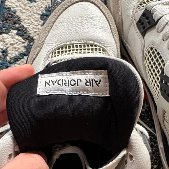 Air Jordan 4 Retro White and Black Sneakers